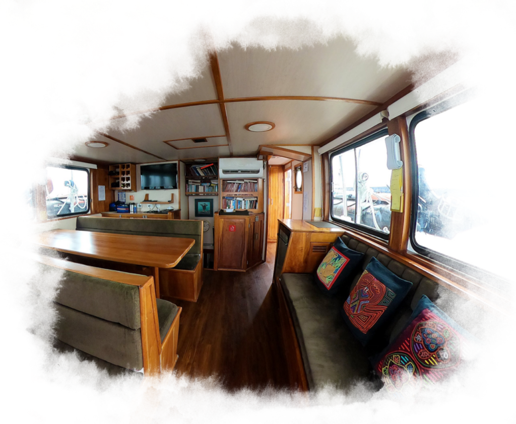 An inside view of the Samba ship with seating and tables.