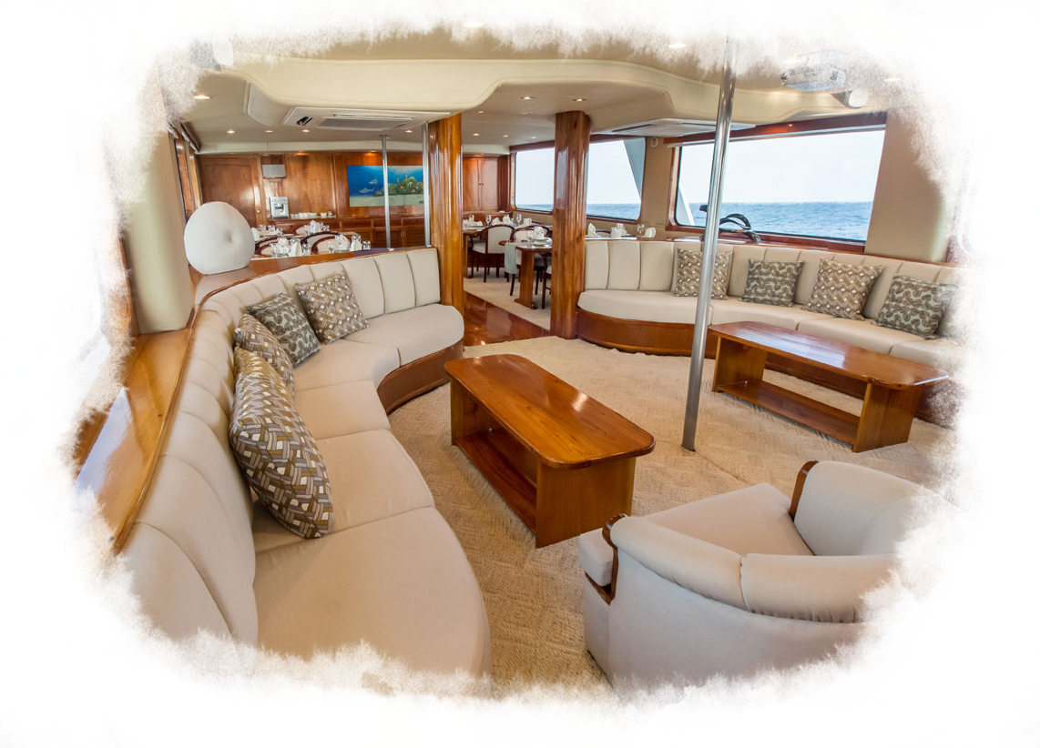 The beautiful wood accents and cream interior of the integrity ship lounge space.